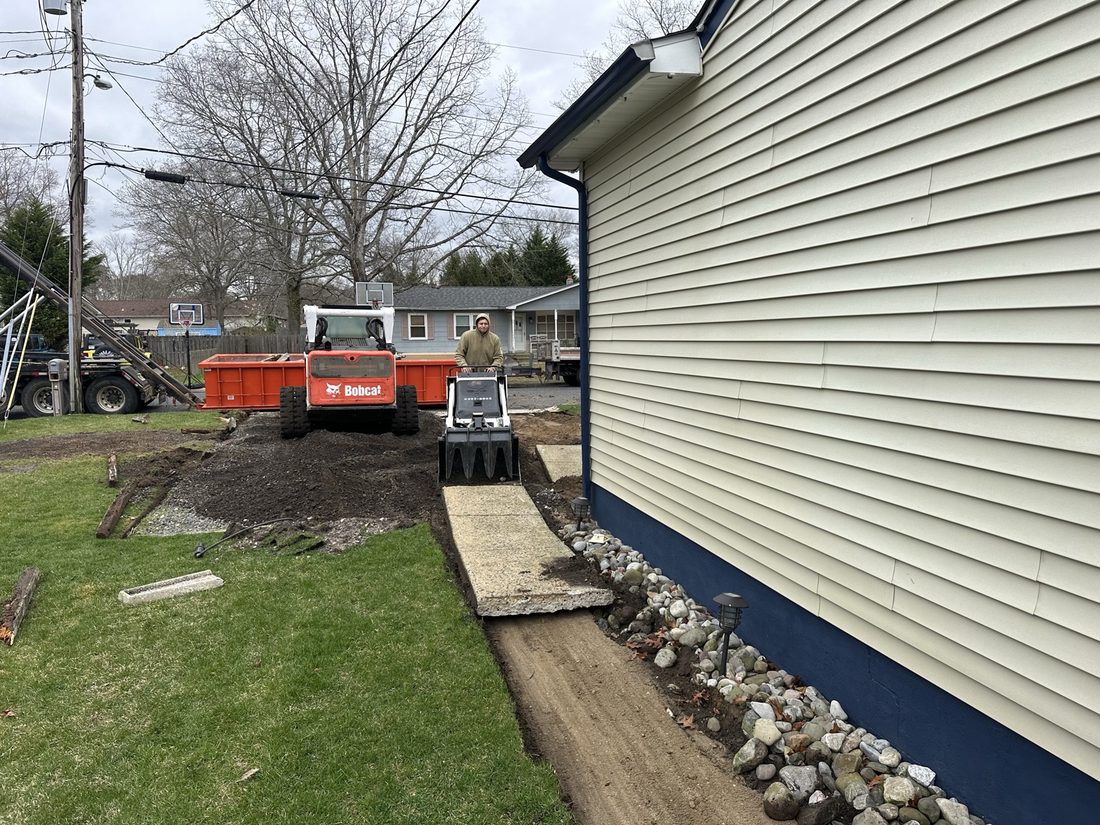 Crew on site: stone, grading and cleanup