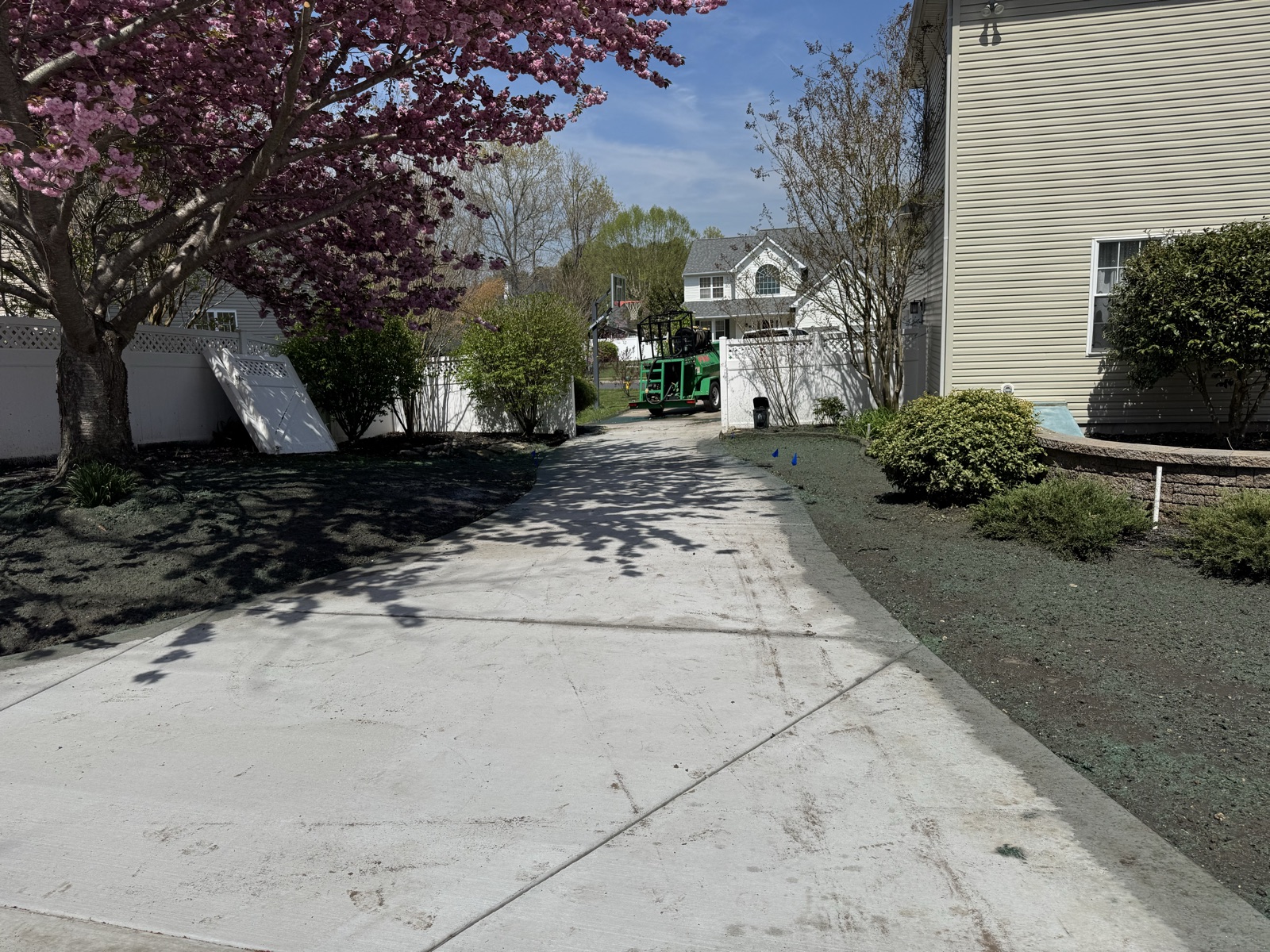 Freshly finished asphalt driveway at a residential home