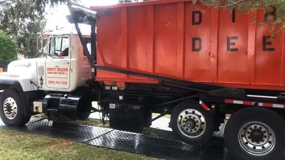 All Dirty Deeds Done Dirt Cheap roll-off dumpster truck